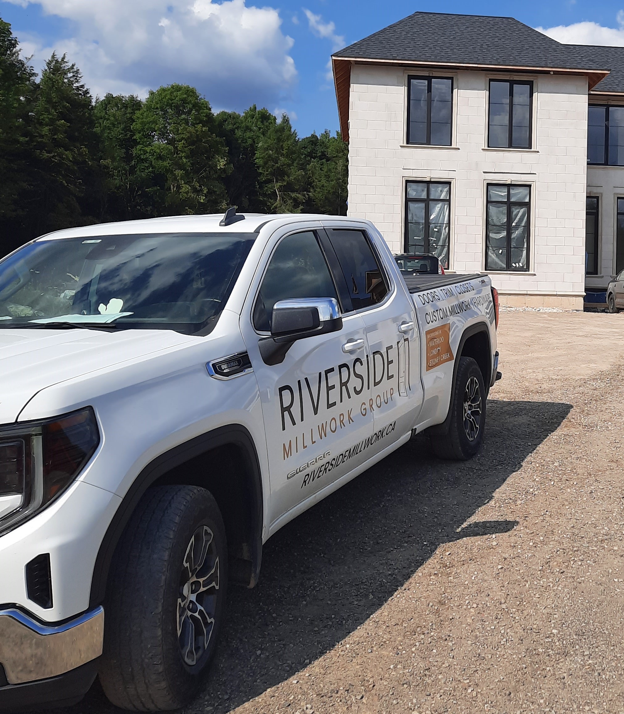 Riverside truck in front of new house