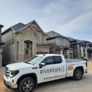 Riverside truck in front of new housing development