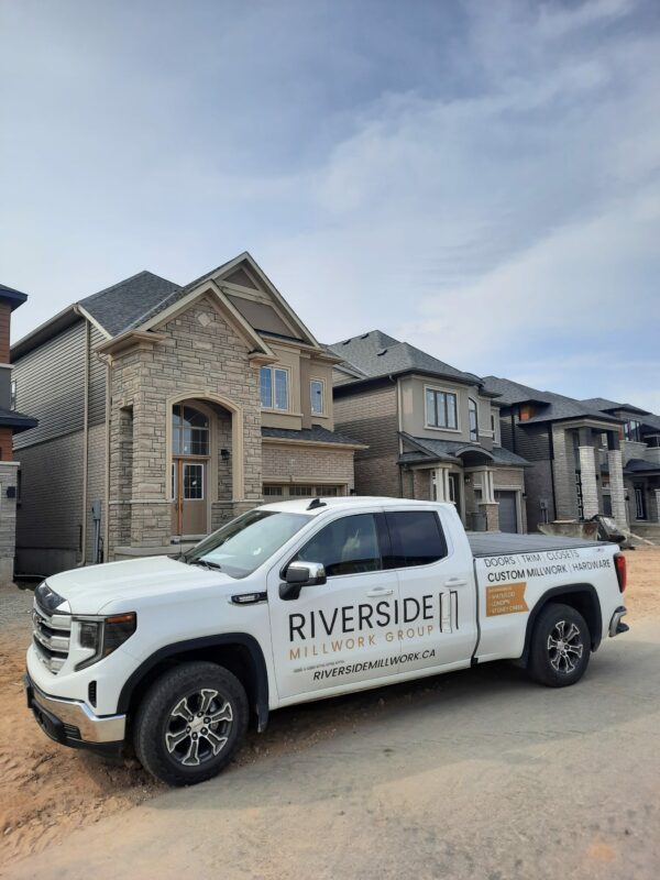 Riverside truck in front of new housing development