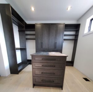 walk-in closet with this deep finish giving contrast to the light walls and flooring. 